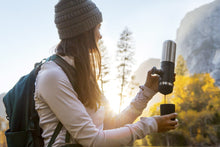 Load image into Gallery viewer, Nanovessel. Wacaco. Espresso für überall. Camping und Caravaning. Lifestyle Bild im Wald. Farbe: Silber.